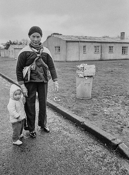 Vietnamese man and child at Sopley Refugee Camp, New Forest, 1980. (John Perivolaris) Vietnamese man and child at Sopley Refugee Camp, New Forest, 1980. (John Perivolaris)