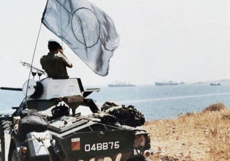 A United Nations trooper observes Turkish ship movements near Karavas, Cyprus, 4 August 1974. Associated Press/Alamy Stock Photo.