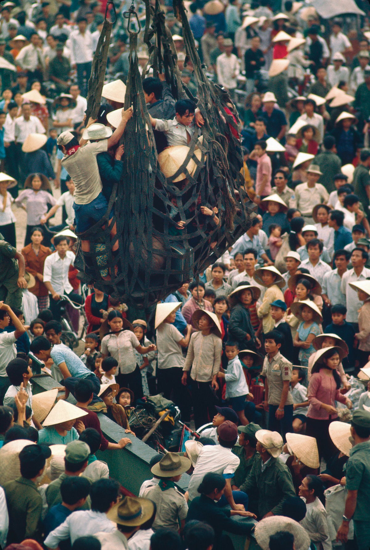 Refugees from Hue arrive on a cargo ship at Da Nang, March 1975. MarkGodfrey/TopFoto.