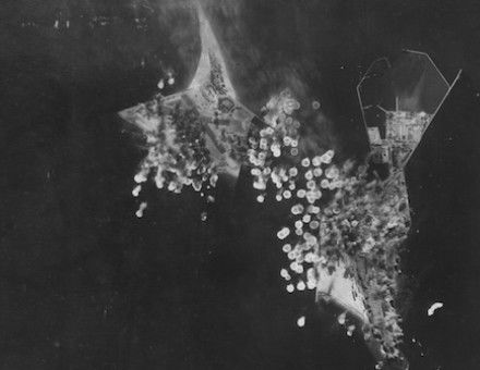 Bombs strike German military installations at Heligoland during a US air force raid, 15 May 1943. US National Archives. Public Domain.