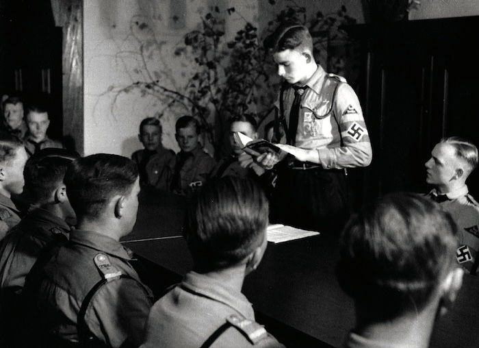 Members of the Hitler Youth reading from Mein Kampf, 1930s. Interfoto/TopFoto.