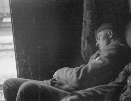 A German soldier sleeps in a railway wagon on his way to the Eastern Front, by Franz Grasser, 1943. Deutsche Fotothek. Public Domain.