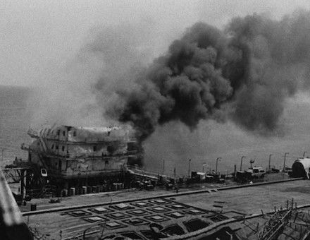 An Iranian oil platform burns after being hit by the US Navy in retaliation for the mining of USS Samuel B. Roberts, 18 April 1988. National Archives and Records Administration. Public Domain.