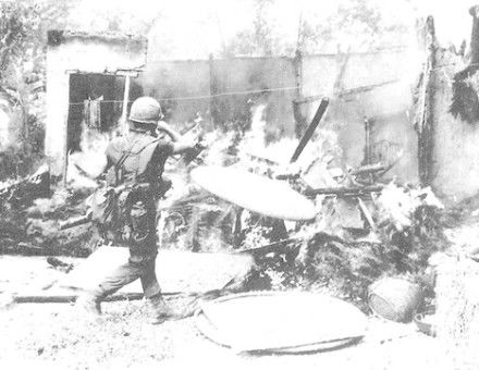 A US soldier sets a building alight on 16 March 1968, by Ronald L. Haeberle, from Report of the Department of the Army Review of the Preliminary Investigations Into the My Lai Incident - Volume III. Library of Congress. Public Domain.