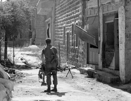 An Israeli soldier patrols the Syrian town of Majdal Shams in the Golan Heights, 1969. National Library of Israel (CC BY).