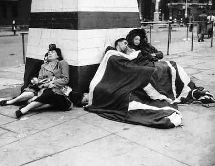 Londoners sleep through the early hours of the morning after a night of celebrations, 8 May 1945. Mirrorpix.